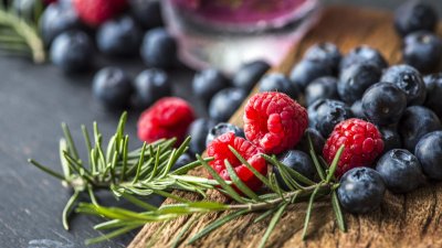 Blueberries and raspberries on a board