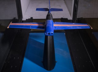 Miniature plane in wind tunnel